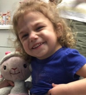 Mia and her stuffed animal at sensory solutions