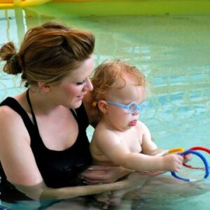 child and mother in a pool for aquatic therapy a pediatric therapy offered by some sensory solutions locations