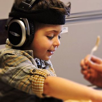 sensory solutions occupational therapy. a young boy learning through occupational therapy.