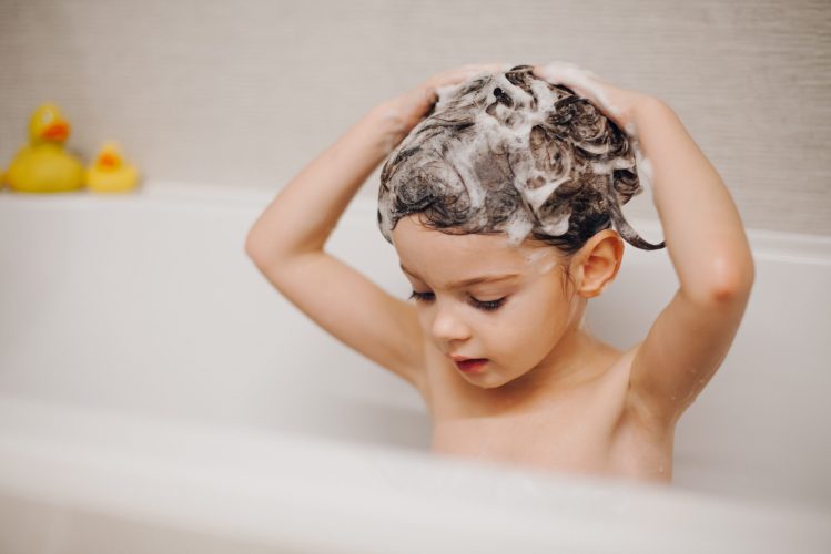 child in the tub hair washing