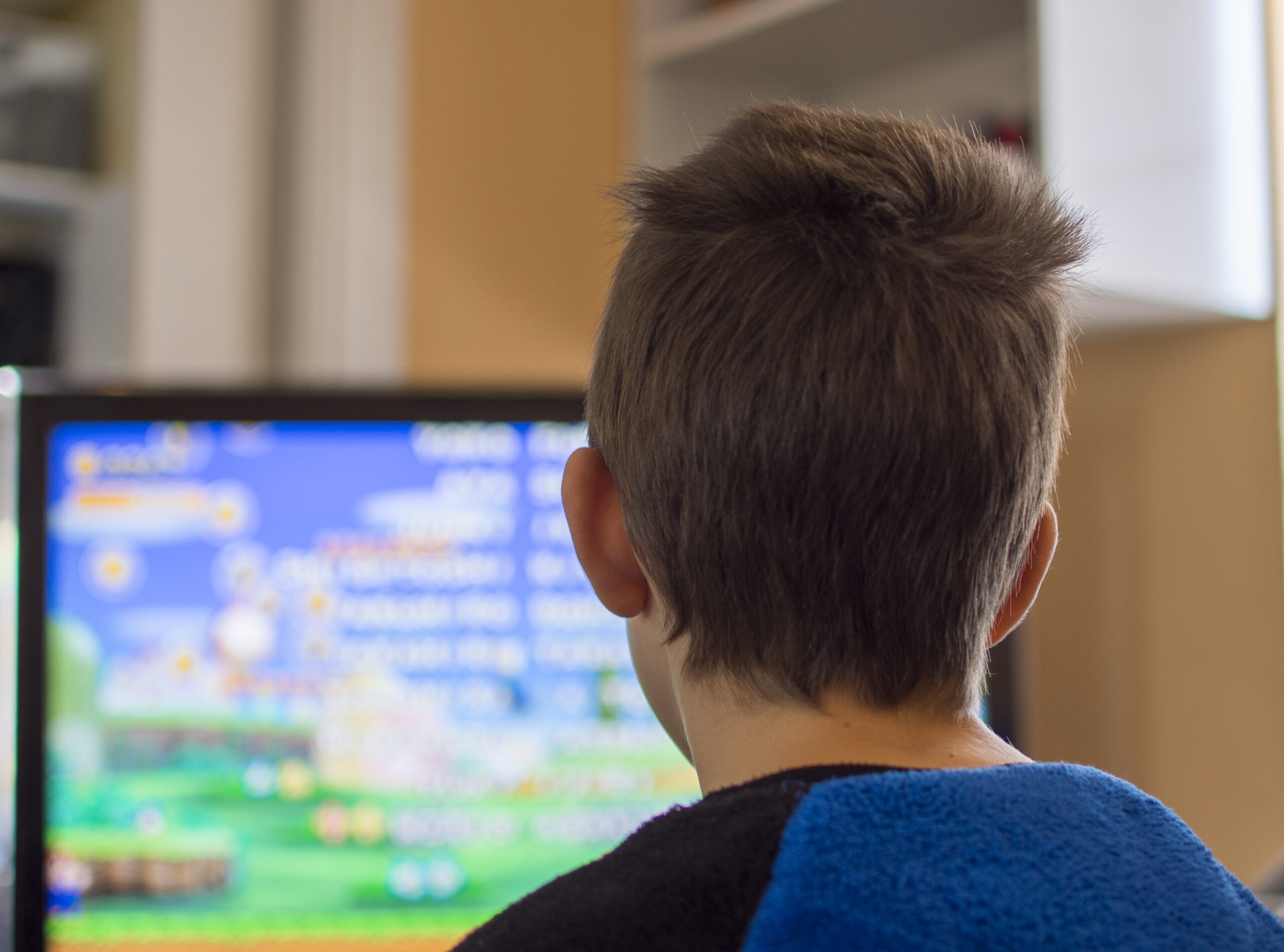 boy watching animated videos to help his communication